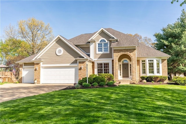 traditional-style home featuring a garage, a front lawn, roof with shingles, brick siding, and concrete driveway
