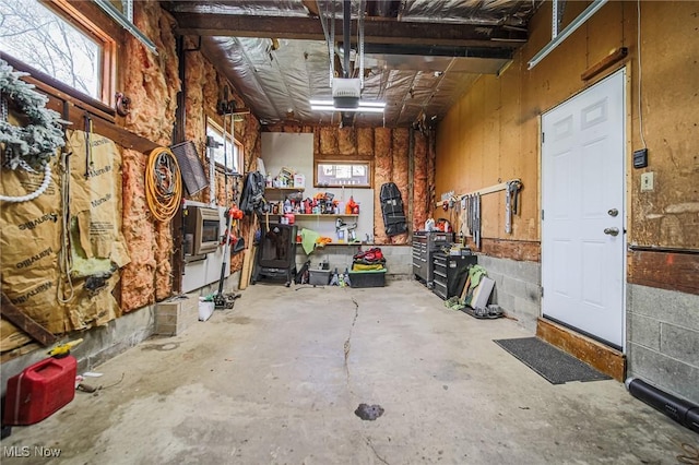 garage featuring a workshop area and a garage door opener