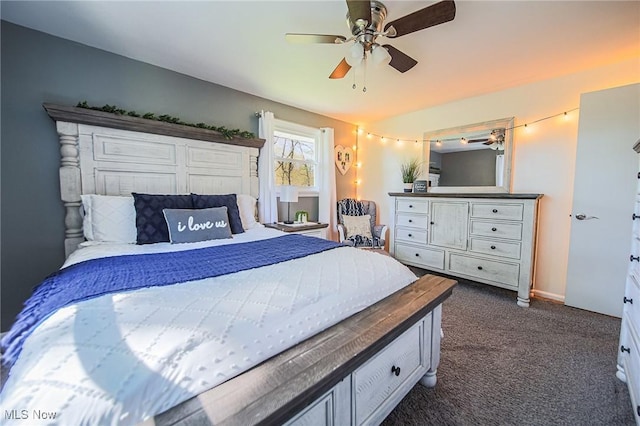 bedroom with dark colored carpet and a ceiling fan