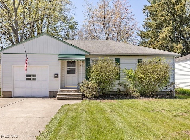 ranch-style home with an attached garage, concrete driveway, and a front lawn