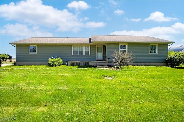 back of house with a yard