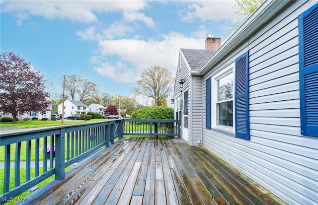 wooden deck featuring a residential view