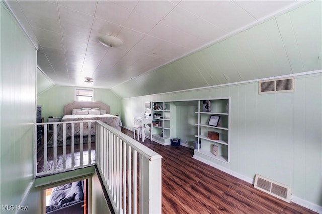 bonus room featuring baseboards, wood finished floors, and visible vents