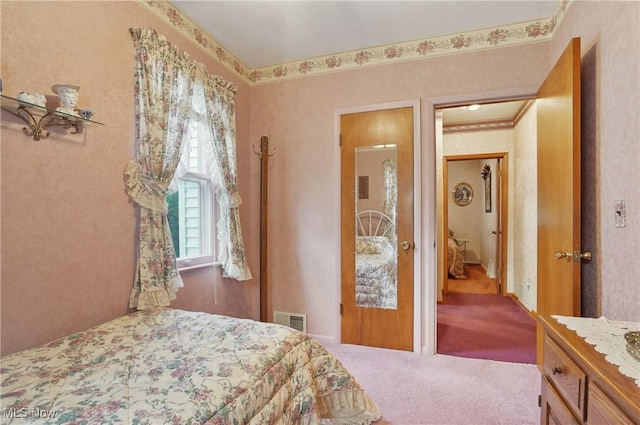 bedroom featuring visible vents and carpet flooring