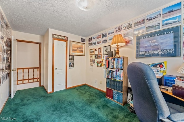 office area featuring carpet flooring, a textured ceiling, and baseboards