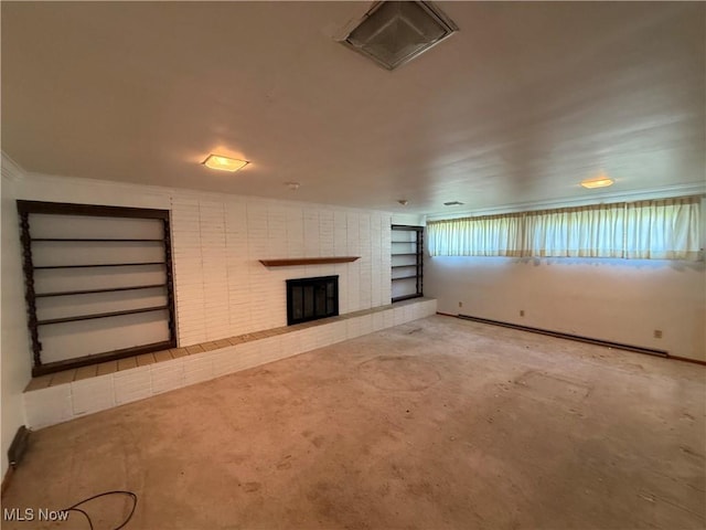 unfurnished living room with built in features and a tile fireplace