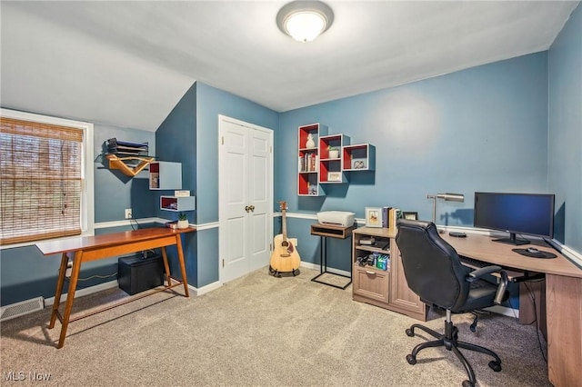 carpeted office space with baseboards and visible vents