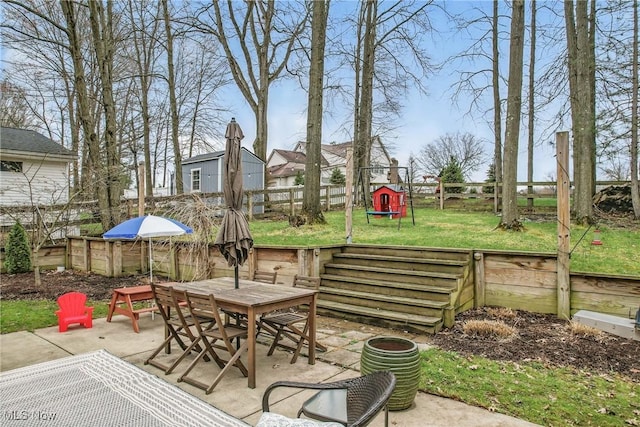 view of patio / terrace with a fenced backyard and outdoor dining space