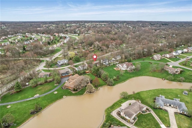 drone / aerial view with a residential view and a water view