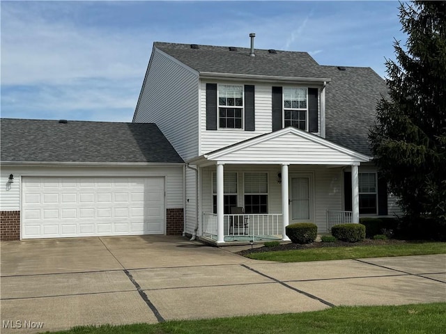 view of front of property featuring covered porch, a garage, brick siding, concrete driveway, and a shingled roof
