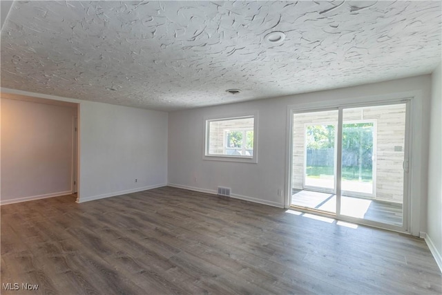 3050 Latimer Ave, Ashtabula, OH 44004 - unfurnished room featuring baseboards, wood finished floors, and a textured ceiling