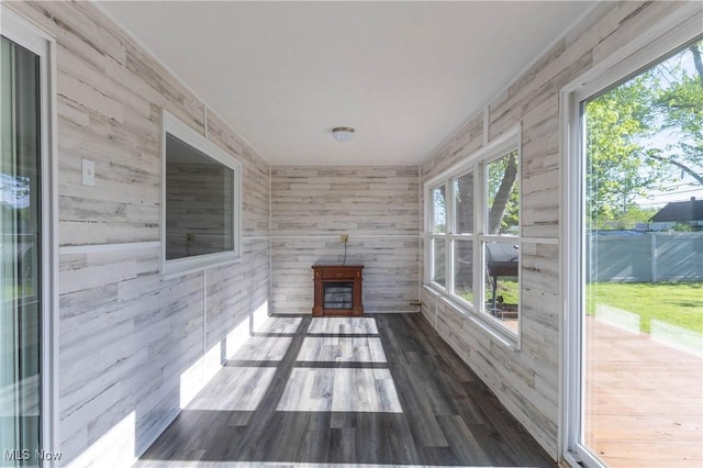 3050 Latimer Ave, Ashtabula, OH 44004 - unfurnished sunroom with wood finished floors and wooden walls