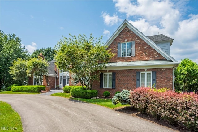 view of front of home featuring brick siding