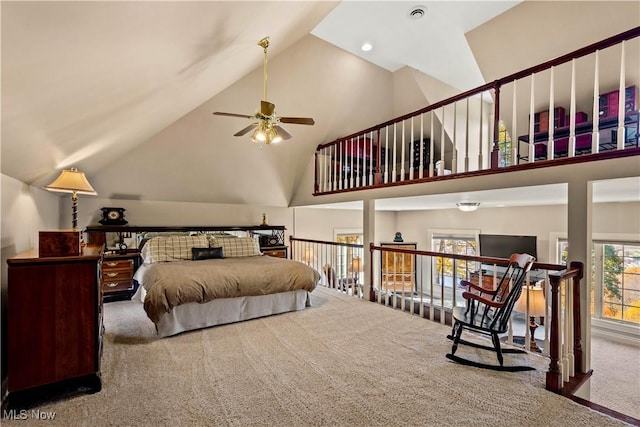 carpeted bedroom with visible vents and high vaulted ceiling