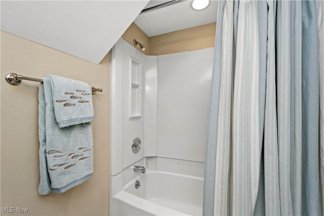 bathroom with shower / tub combo with curtain