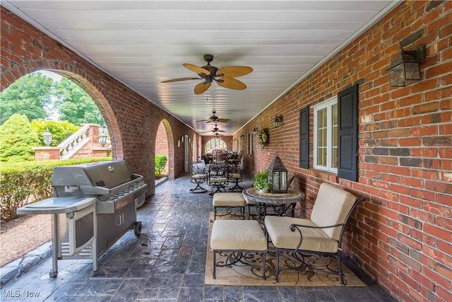 view of patio with ceiling fan and grilling area