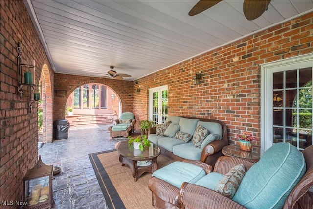 view of patio with an outdoor living space and ceiling fan