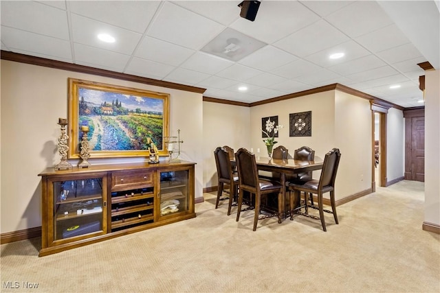 carpeted dining area with recessed lighting, baseboards, and ornamental molding