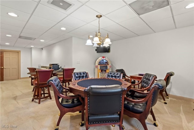 recreation room with carpet flooring, a drop ceiling, and visible vents