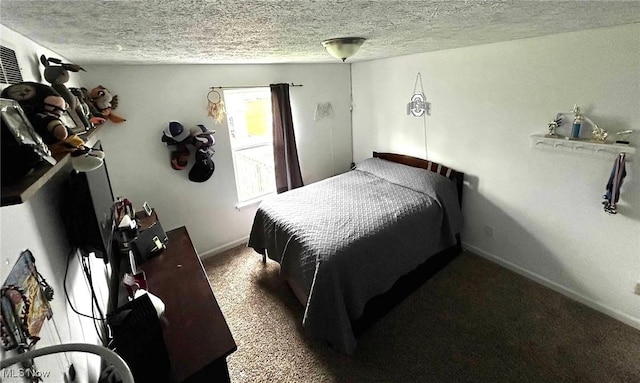 carpeted bedroom featuring baseboards and a textured ceiling