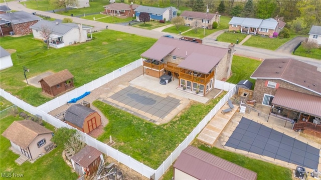 birds eye view of property with a residential view