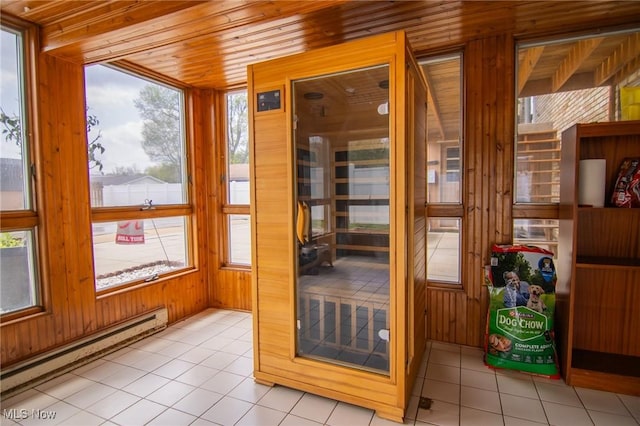view of sauna with tile patterned floors and a healthy amount of sunlight