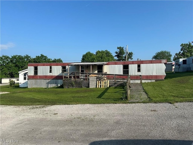 manufactured / mobile home with an outdoor structure and an exterior structure