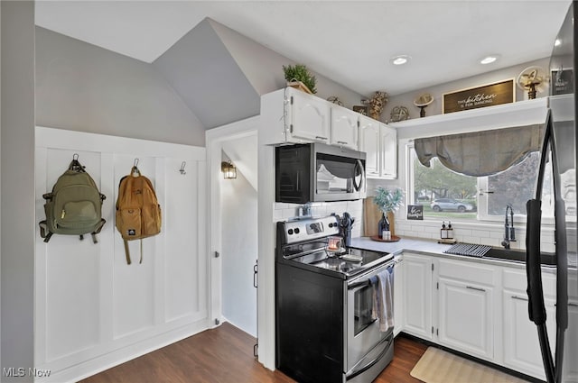 kitchen featuring a sink, decorative backsplash, white cabinetry, and stainless steel appliances