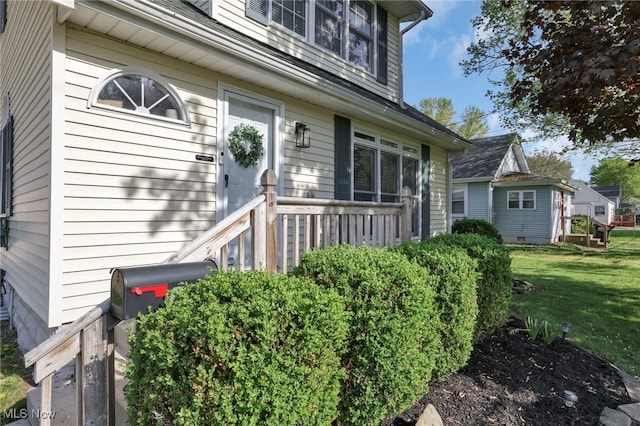 view of property exterior featuring a lawn