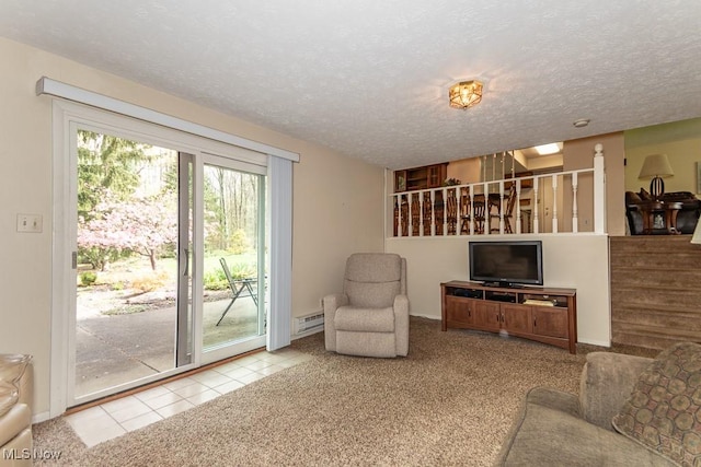 living room featuring tile patterned floors, a baseboard radiator, baseboards, and a textured ceiling