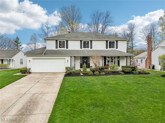 view of front facade featuring an attached garage, a porch, driveway, and a front yard