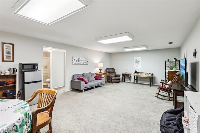 carpeted living room featuring visible vents