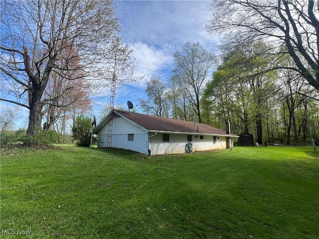 view of home's exterior featuring a lawn
