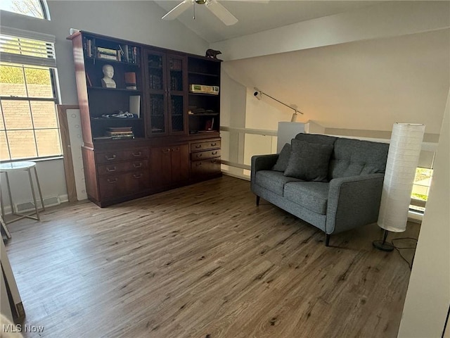 1173 Red Tail Hawk Ct Unit 4, Youngstown, OH 44512 - living area featuring ceiling fan, wood finished floors, and lofted ceiling
