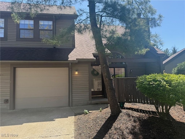 1173 Red Tail Hawk Ct Unit 4, Youngstown, OH 44512 - view of front of property featuring an attached garage, driveway, and roof with shingles