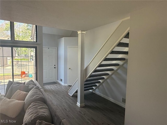 1173 Red Tail Hawk Ct Unit 4, Youngstown, OH 44512 - stairway with baseboards, decorative columns, and wood finished floors