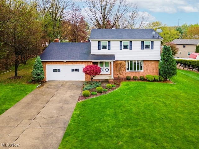 view of front facade featuring an attached garage, brick siding, a front yard, and concrete driveway