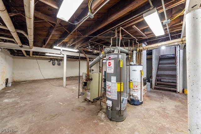 unfinished below grade area featuring stairway, gas water heater, and a heating unit