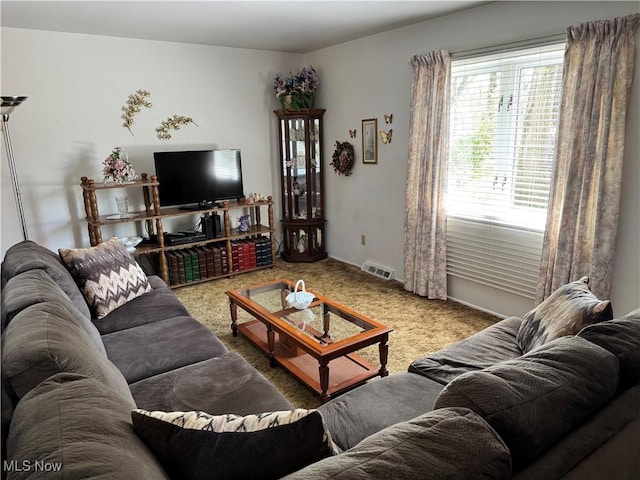 living room featuring carpet flooring and visible vents