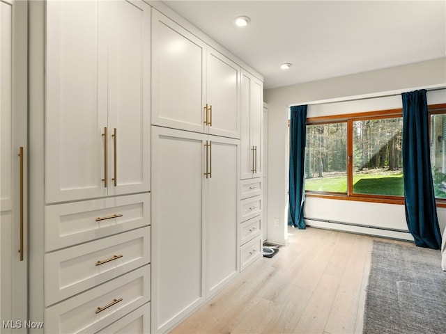 interior space featuring a baseboard heating unit