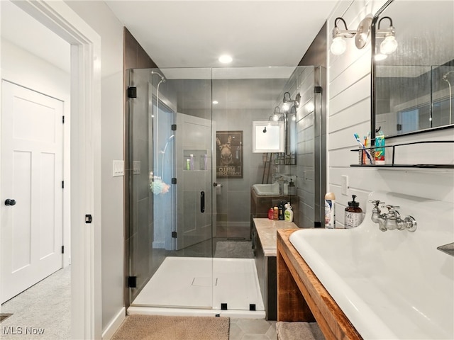 16165 Thompson Rd, Thompson, OH 44086 - bathroom with a shower stall, vanity, baseboards, and recessed lighting