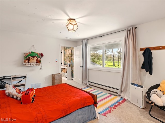 bedroom featuring visible vents, baseboard heating, and light carpet