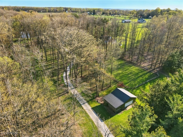 aerial view featuring a view of trees