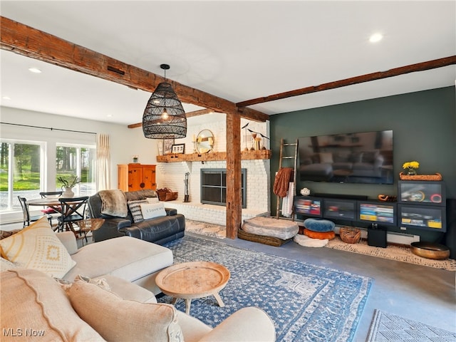 living room with a fireplace and beamed ceiling