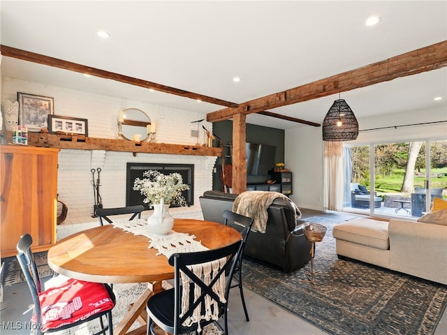 16165 Thompson Rd, Thompson, OH 44086 - dining space featuring beam ceiling, a brick fireplace, recessed lighting, and brick wall