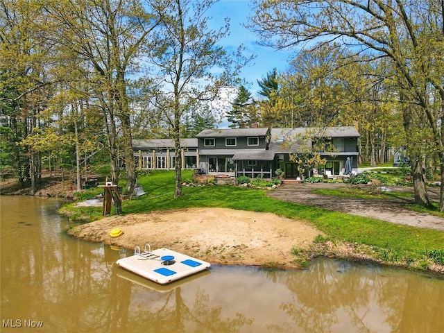 16165 Thompson Rd, Thompson, OH 44086 - rear view of property with a yard and a water view