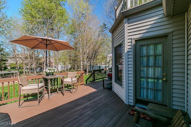 deck featuring outdoor dining area