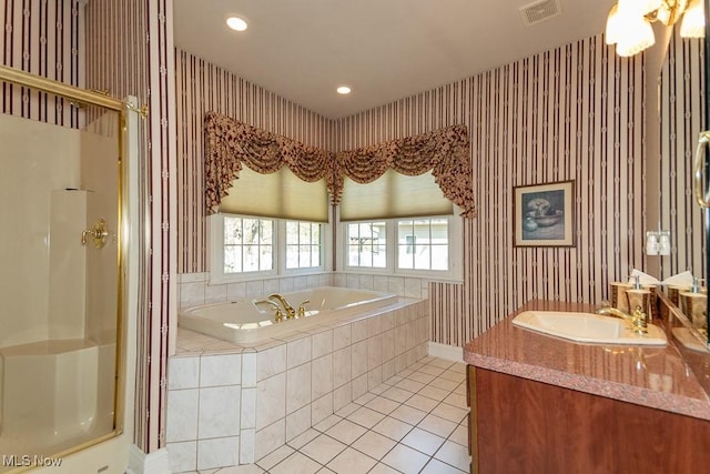full bathroom with tile patterned flooring, a shower stall, a garden tub, and visible vents