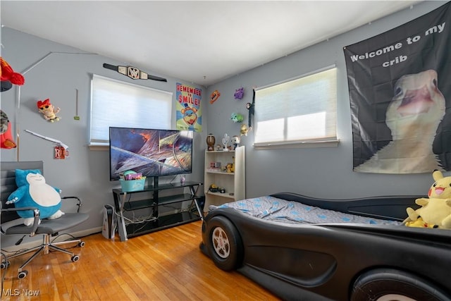 bedroom with wood-type flooring