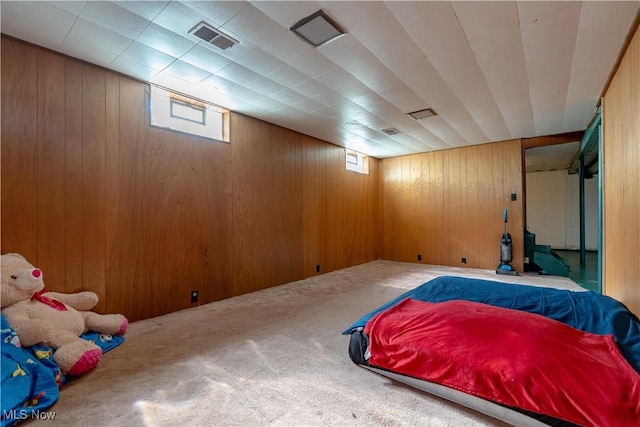 interior space featuring wood walls and visible vents